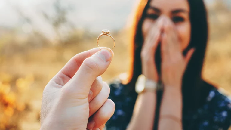 girl looking surprisingly at a diamond engagement ring